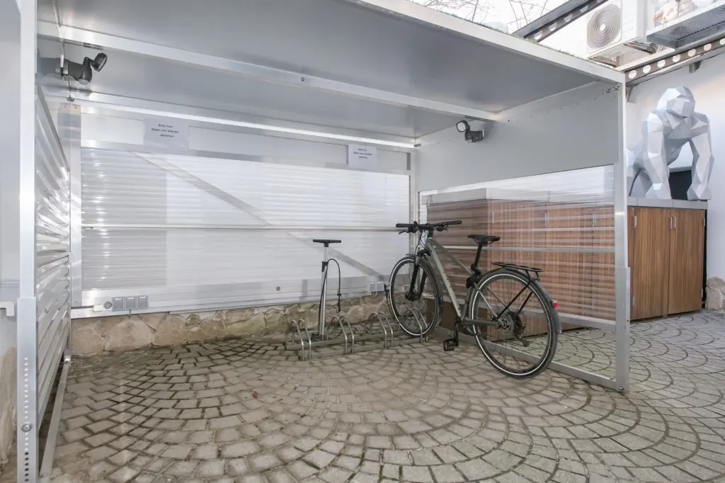 Bicycle garage with charging stations
